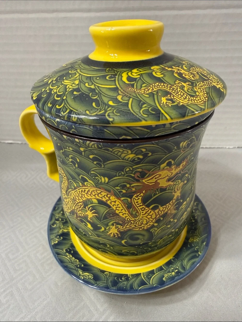 Porcelain Tea Cup Set Lid Saucer and Infuser Chinese Dragon Motif Yellow & Green